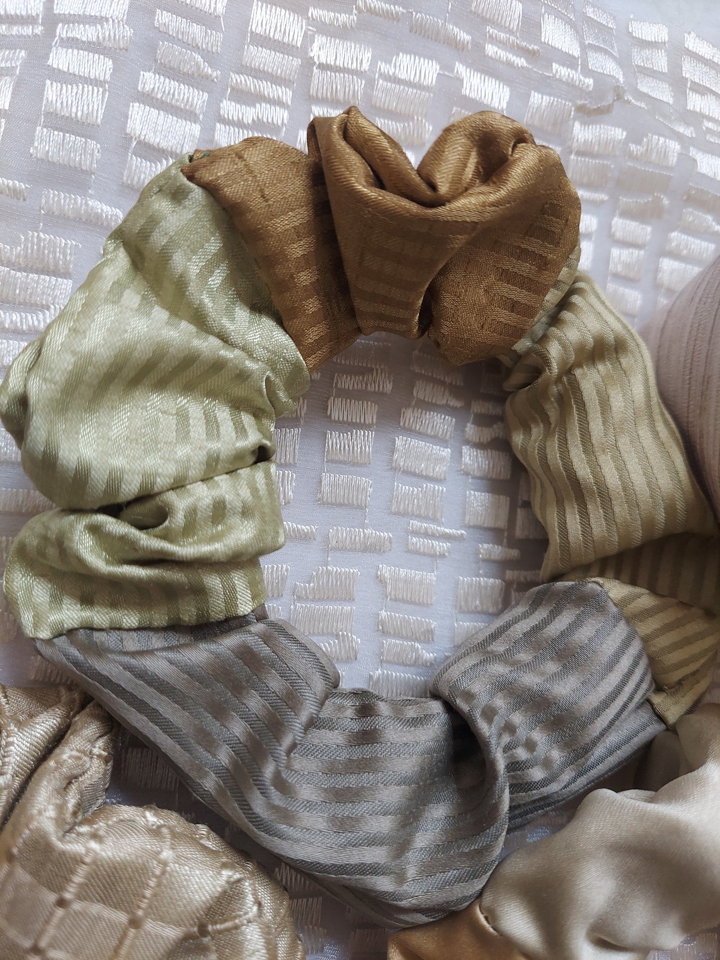 4 scrunchies in similar shades and different textures