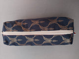 Navy blue and gold pouch