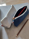 Pair of contrast color triangular pouches